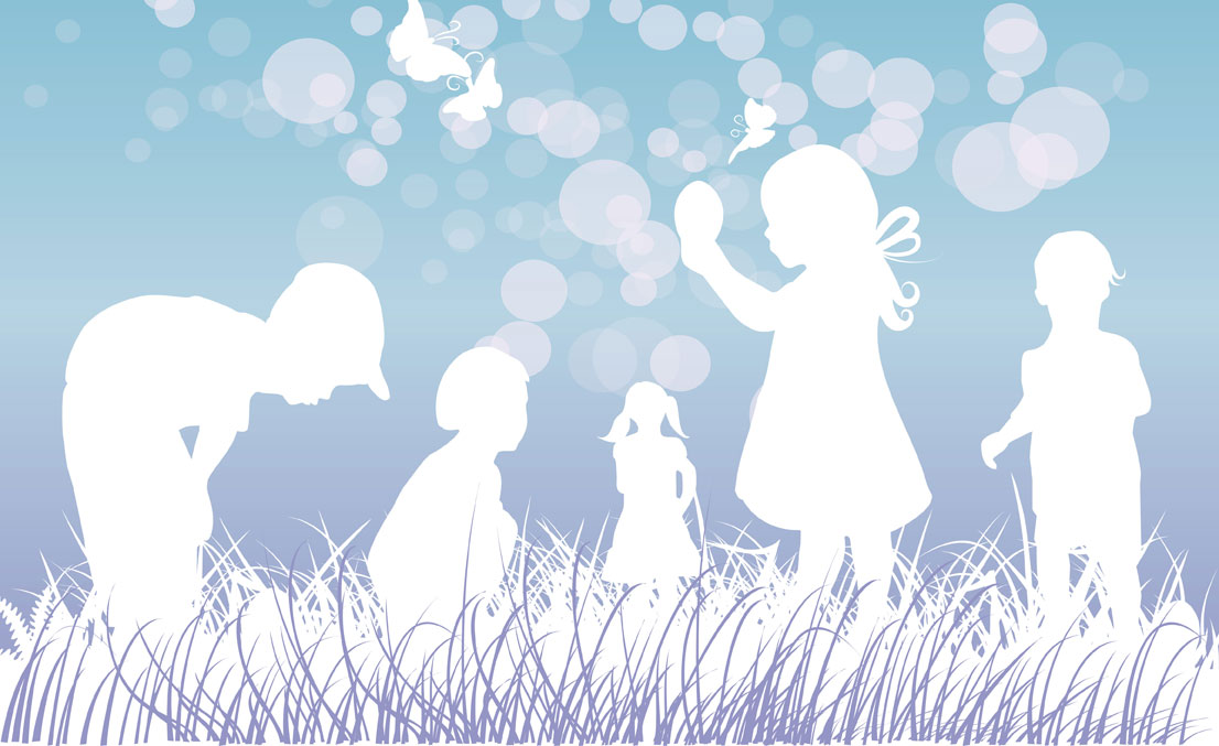 Kinder spielen im Gras